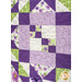 A close up on one of the blocks, demonstrating fabric, piecing, and top quilting details.
