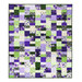 The completed Ten Square Scramble Quilt, colored in bright purple, cream, and green fabrics from the Georgina collection, isolated on a white background.