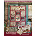 Cover of Frosty's Bakery featuring an appliqué quilt with food-themed blocks, winter decor, and a snowman.