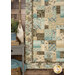 A shot of the lower left corner of the quilt, with coordinating outdoorsy decor in the left side of the frame.