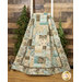 The Easy as ABC and 123 Quilt - Nature's Landscapes quilt featuring a patchwork design in neutral tones hanging from a wooden ladder next to green trees in front of a wood paneled wall.