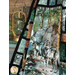 A shot of the panel quilt artfully draped in front of a dresser staged with coordinating decor and greenery, demonstrating dimension and movement.