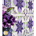 An angled shot of the quilt bordered by a vase with coordinating purple florals, demonstrating fabric, piecing, sashing, border, and binding details.