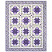 A floral-patterned quilt featuring green and purple colors with a geometric design, isolated on a white background.