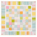 A colorful patchwork quilt featuring a grid of assorted squares in pastel shades and playful patterns isolated on a white background.