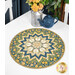 The Bees Knees table topper with a floral star pattern in blue, yellow, and green, next to a silver vase and teal teapot.