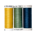 Three spools of thread in yellow, green, and blue.