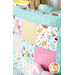 A close up of the top right corner of the quillow demonstrating piecing and fabric details.