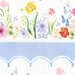 An 8x8 close up scan of the border stripe fabric, showcasing delicate scalloped details and bright garden flowers.