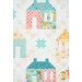 A super close up on the house, star, and four patch blocks of the quilt, showing fabric print and color details.