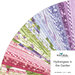 A fanned out collage of the pink, green, blue, and purple fabrics featured in the Hydrangeas in the Garden Jelly Roll..