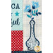 Close-up of a quilt featuring embroidered text with a decorative vase with blue flowers.