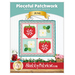 Front cover of the pattern showing the finished June wall hanging in bright red, blue, green, and white fabrics and staged on a white paneled wall with coordinating decor.