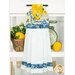 The completed Hanging Towel colored in blue and yellow fabrics from the Limoncello collection, staged on a kitchen drawer with coordinating decor.