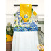A close up on the top section of the towel, showing details on the wordy fabric as well as the fabric button.