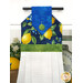 A close up on the top section of the towel, showing details on the lemon fabric as well as the fabric button.