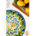 A top down view of the topper staged next to coordinating lemon decor.