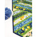 A close up on the patchwork of the table runner, demonstrating fabric and piecing details.