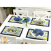 A shot of a table with four table settings using the placemats and coordinating cutlery, napkins and decor.