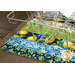 A close up on the completed mat underneath a wire dish rack, demonstrating usage and fabric strip print details.