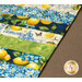 A close up on the completed mat, demonstrating fabric strip print and color details.
