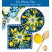 The two completed blue Folded Star Hot Pads, one round and one square, slightly overlapping each other and staged on a white table with coordinating florals, decor, and wooden spoons.
