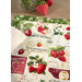 A shot of the placemat on a table with a cloth napkin and coordinating strawberry decor peeking into frame.