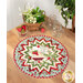 The completed Point of View Folded Star Table Topper colored in red, green, white, and light blue fabrics from the Berry Sweet collection. The topper is staged on a wood table with coordinating berry and summer-themed decor.