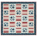 A patchwork quilt featuring alternating star patterns and striped designs in red, white, and blue, isolated on a white background. 