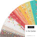 A fanned collage of the summer fabrics included in the In the Garden Jelly Roll.
