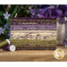 A stack of the floral fabrics inclusded in the Collections for a Cause Essence F8 set, with flowers and a vase and thread