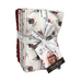 A bundle of fabric squares featuring a patriotic pattern, tied with a white ribbon and tag.