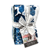 A stack of green, white, and blue floral prints tied together with a ruler ribbon, isolated on a white background.
