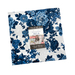 A stack of green, white, and blue floral prints, isolated on a white background.