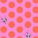 A bright pink fabric with large salmon polka dots and tossed starlings.