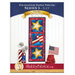 Front cover of the Foundation Paper Piecing Series 3 - July pattern showing the completed star and flag project in red, white, gold, and blue fabrics, staged on a golden craft hanger on a white paneled wall.