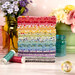 A stack of the fabrics included in the Sweet Things FQ Bundle, with flowers and jars and pots and thread.