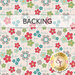 Light gray fabric with colorful flowers with a transparent backing label at the top.