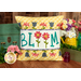 The finished May pillow wrap kit, a white wrap with the word 