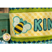A super close up on the appliqué bee, showing fabric and top stitching details.