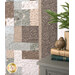 A patchwork quilt with intricate patterns in muted blues and browns is displayed beside a decorated nightstand..