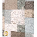 Quilted fabric featuring a patchwork of nature-themed patterns in soft beige, blue, and brown tones.