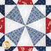 A close up on one of the patchwork blocks of the table runner, demonstrating fabric color and detail as well as top quilting details.