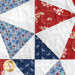A close up on one of the patchwork blocks of the table runner, demonstrating fabric color and detail as well as top quilting details.