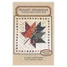 The front of the pattern featuring a digital version of the finished quilt on a fabric background.