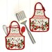 Two of the completed apron hot pads, colored in strawberry themed fabrics, staged on a white paneled background with kitchen utensils.