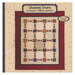 The front of the pattern featuring a digital version of the finished quilt on a fabric background.
