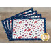 Four patriotic placemats with a white center featuring red, blue, and star patterns on a navy border.
