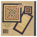 The back of the pattern with the finished runner and pillow on a fabric background.