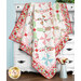 A shot of the quilt artfully draped over a white hutch, demonstrating movement and form.